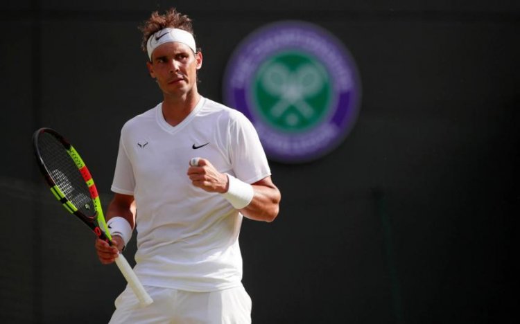 Nadal marches in eighth Wimbledon quarter-final, coy on new injury