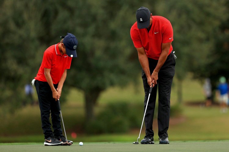 Tiger Woods is a caddie for his son who qualifies for the National Championship